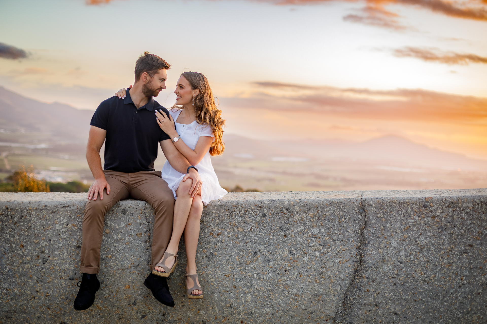 Couple at sunset viewpoint